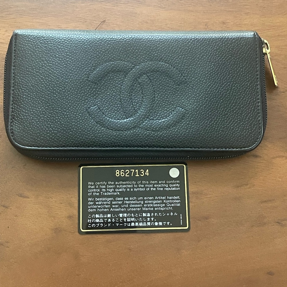 Authentic Chanel vintage caviar leather black long zippy wallet.